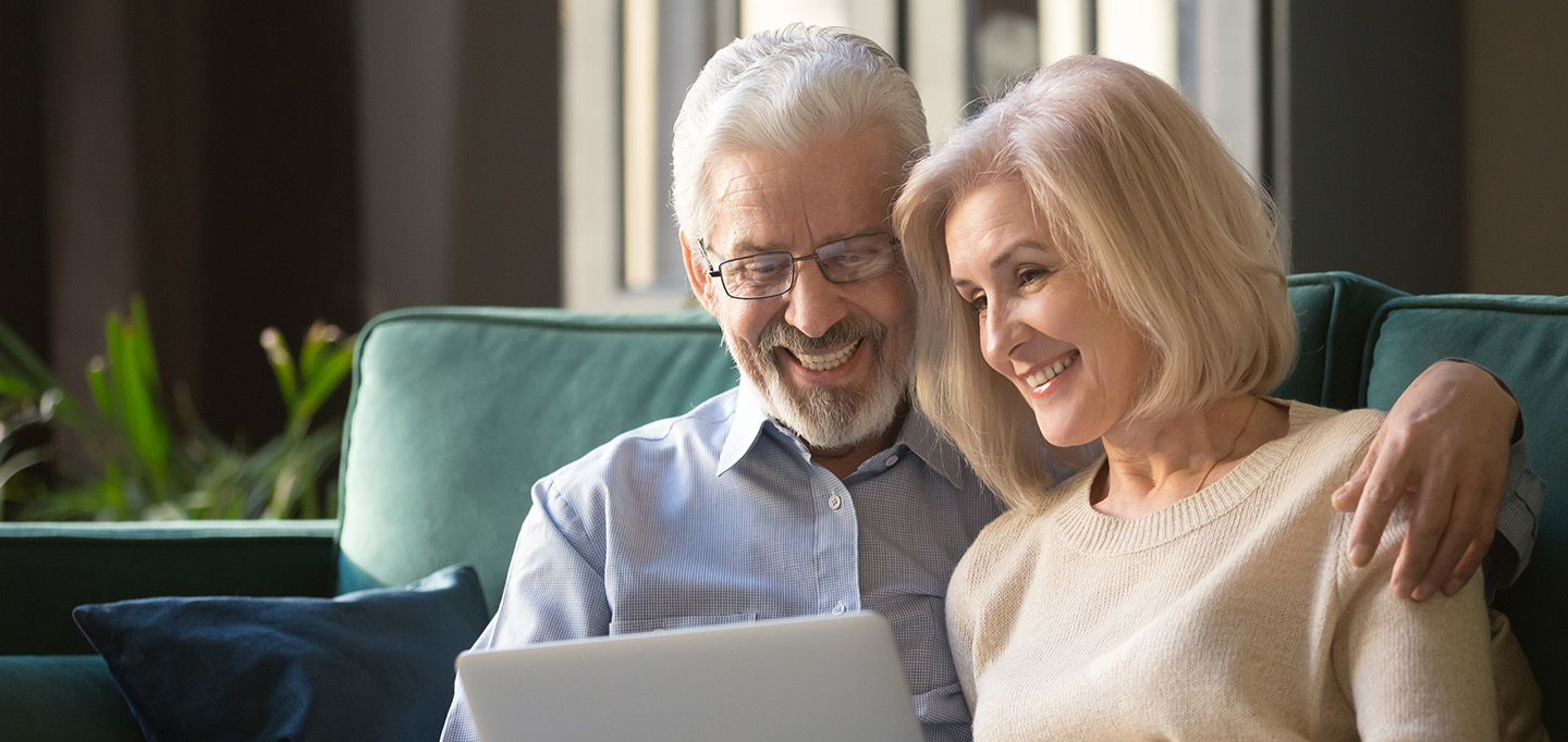 Senior couple using IdentoGO, which has partnered with VitalChek Express Certificate Service by LexisNexis, to get a birth certificate quickly.